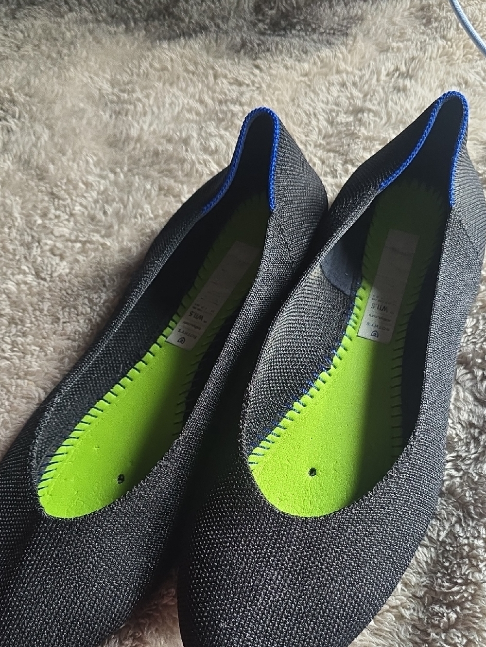 Rothy's Black Slip-On with Neon Green Insole and Blue Stitching Detail